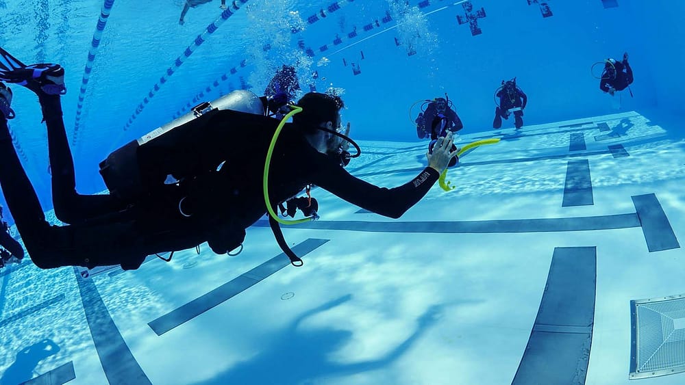 SDI Assistant Instructor with students in pool