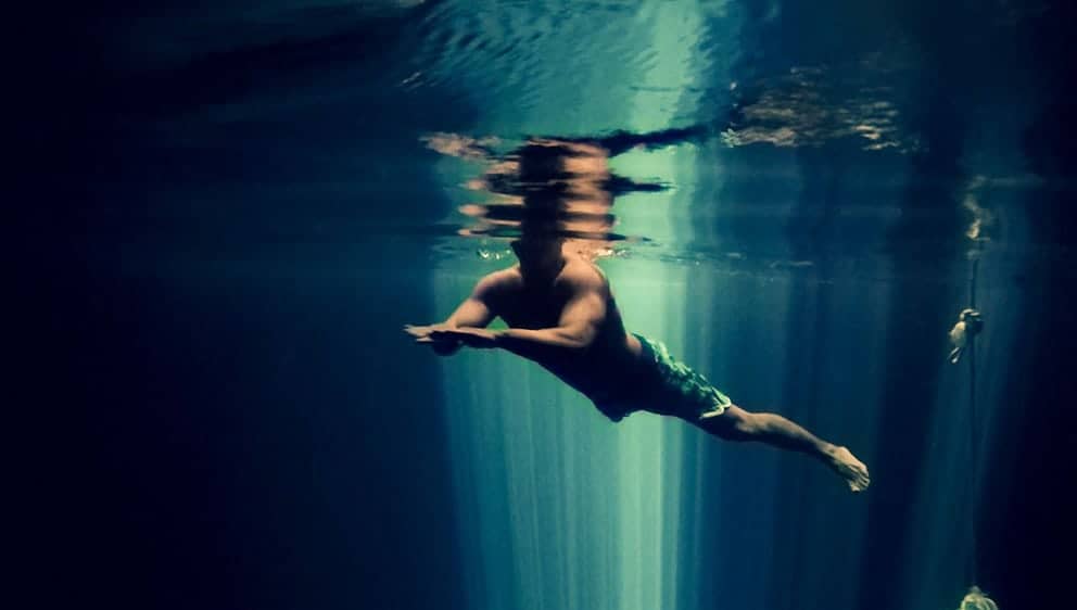 swimmer in cenote